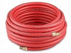 A roll of red hose with brass fittings on a white background.