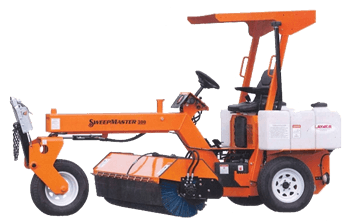 An orange tractor with a broom attached to it