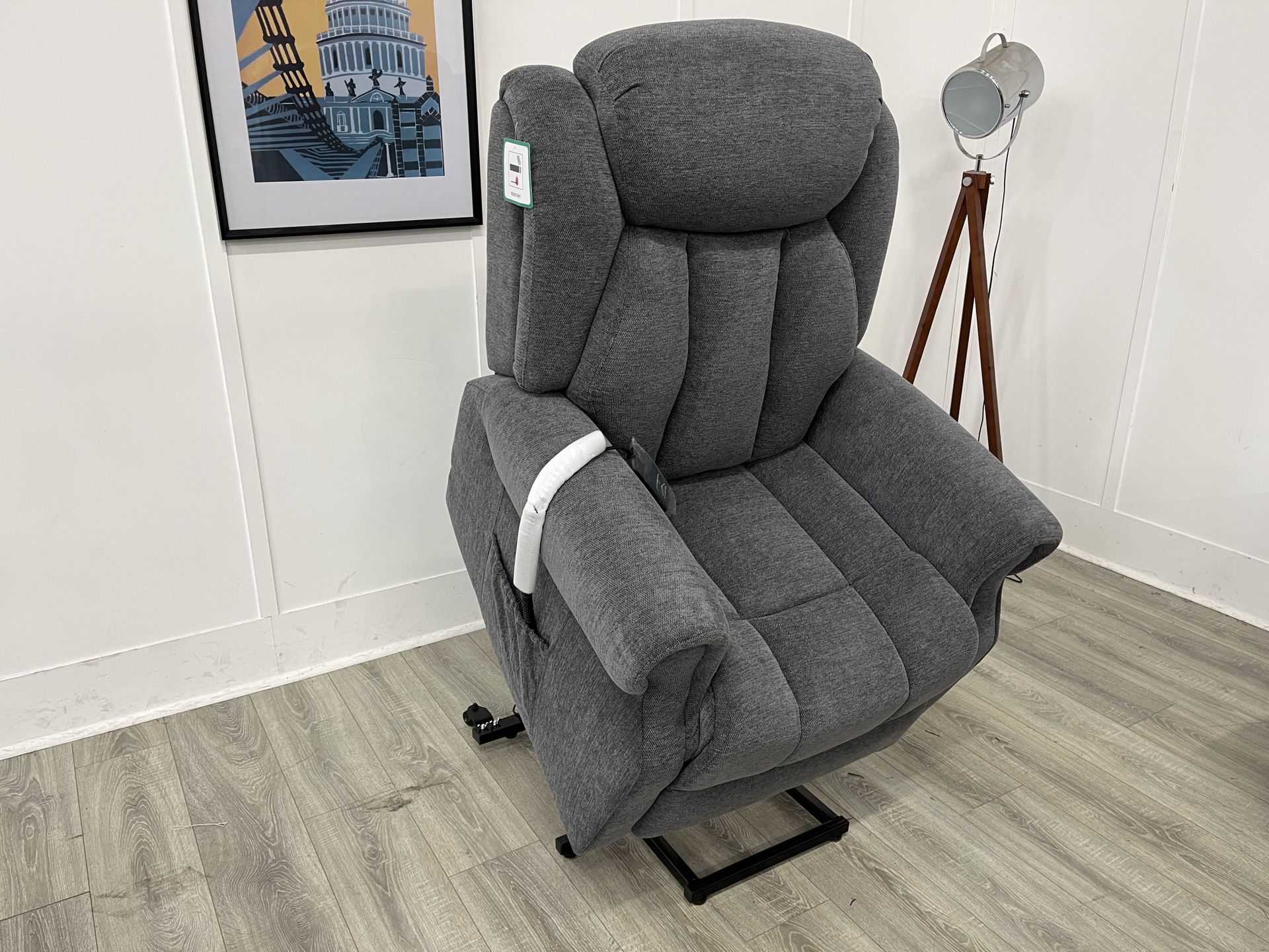 Two gray armchairs with patterned pillows on a light wood floor beside a gray sofa delivery in Rotherham
