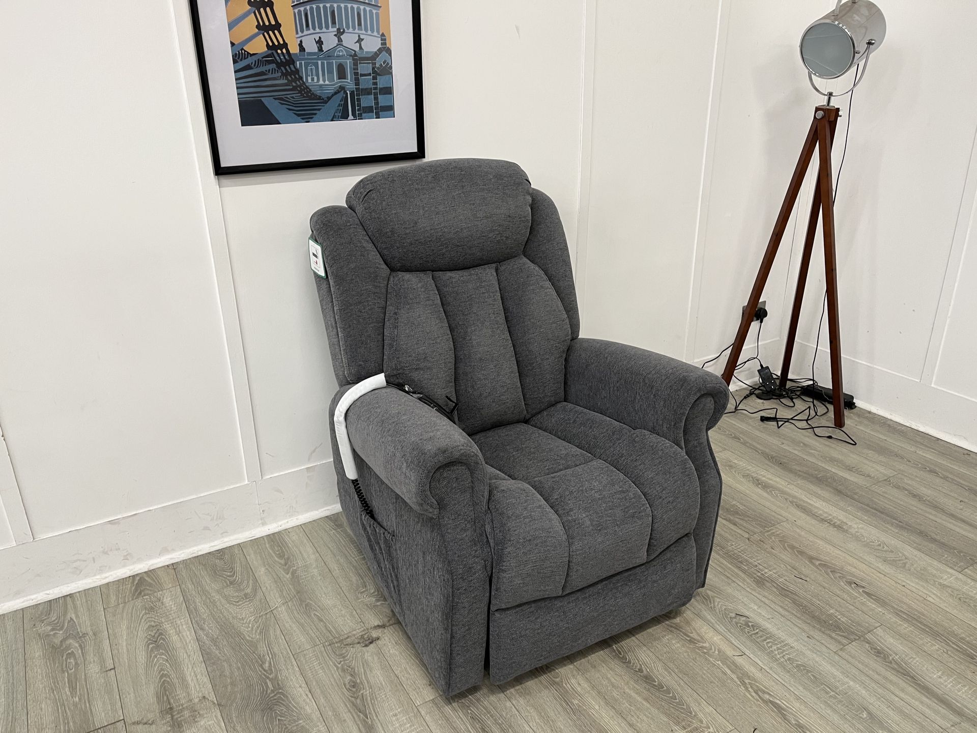 Two gray armchairs with patterned pillows on a light wood floor beside a gray sofa delivery in Rotherham