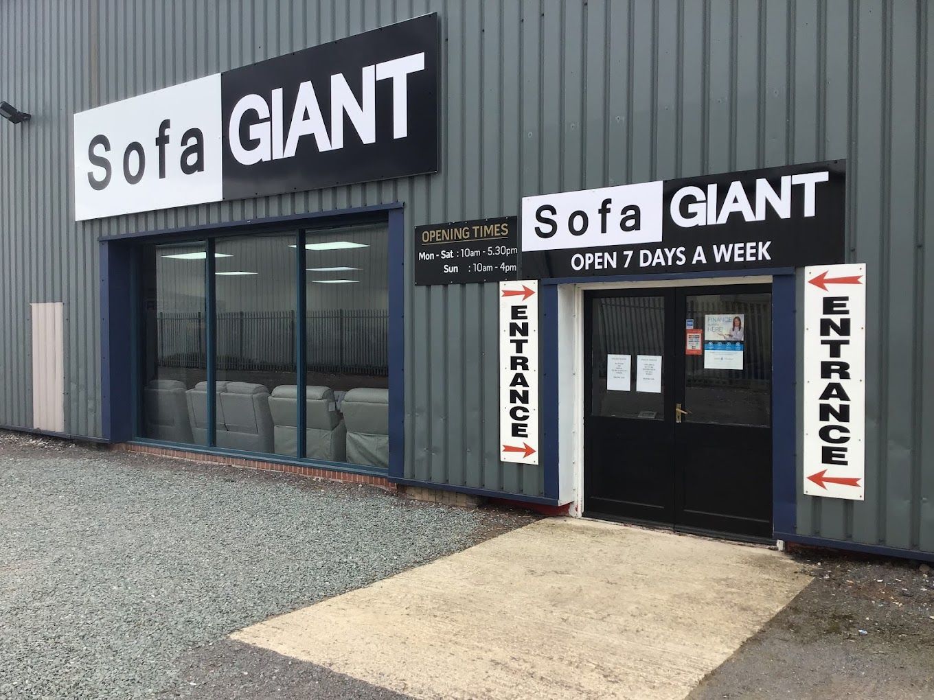 Sofa Giant store exterior with large sign, glass windows, and entrance marked