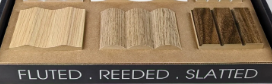 Wood samples labeled fluted, reeded, and slatted on a display board.