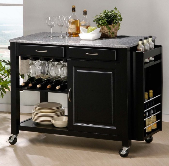 Black rolling kitchen island with granite top, wine rack, shelves, and bottles in a studio setting