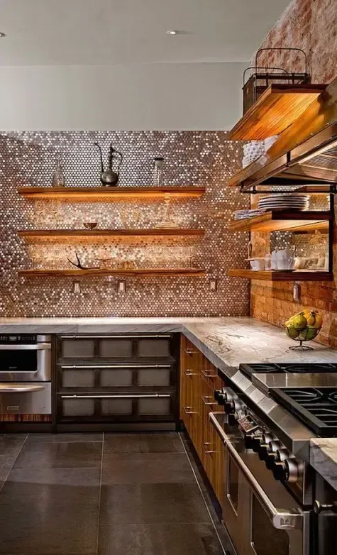 Modern kitchen with copper backsplash, open wooden shelves, and stainless steel appliances