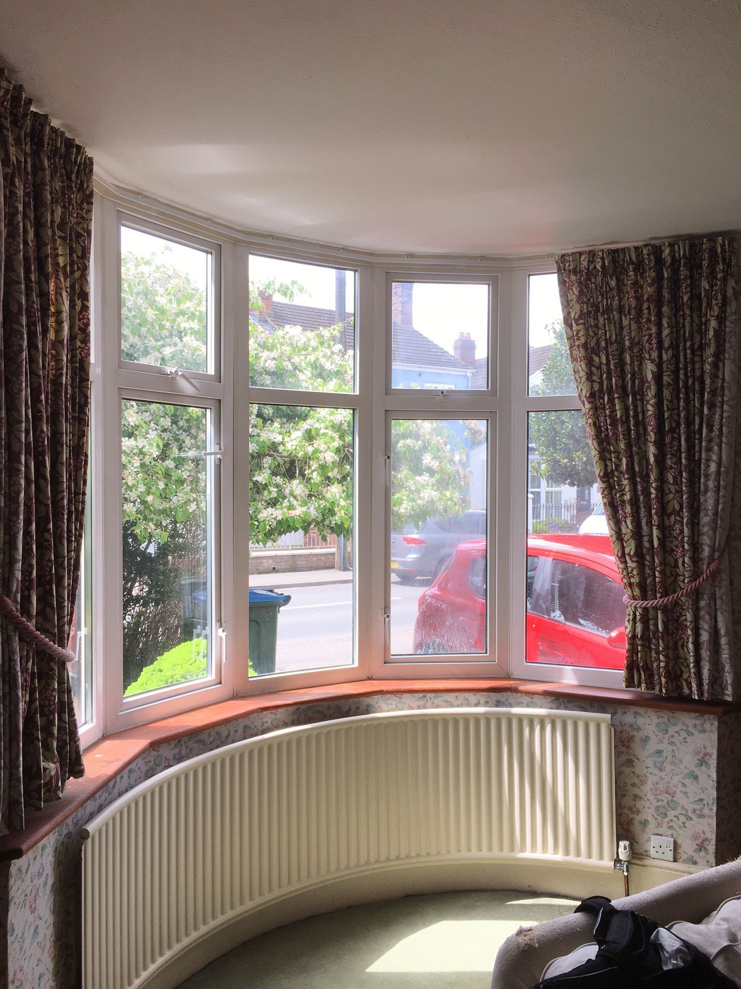 Curtain tracks fitted into a bay window
