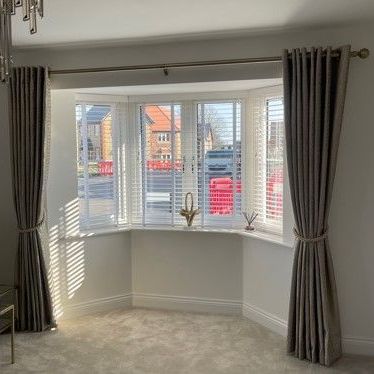 Curtains with tie backs for a bay window