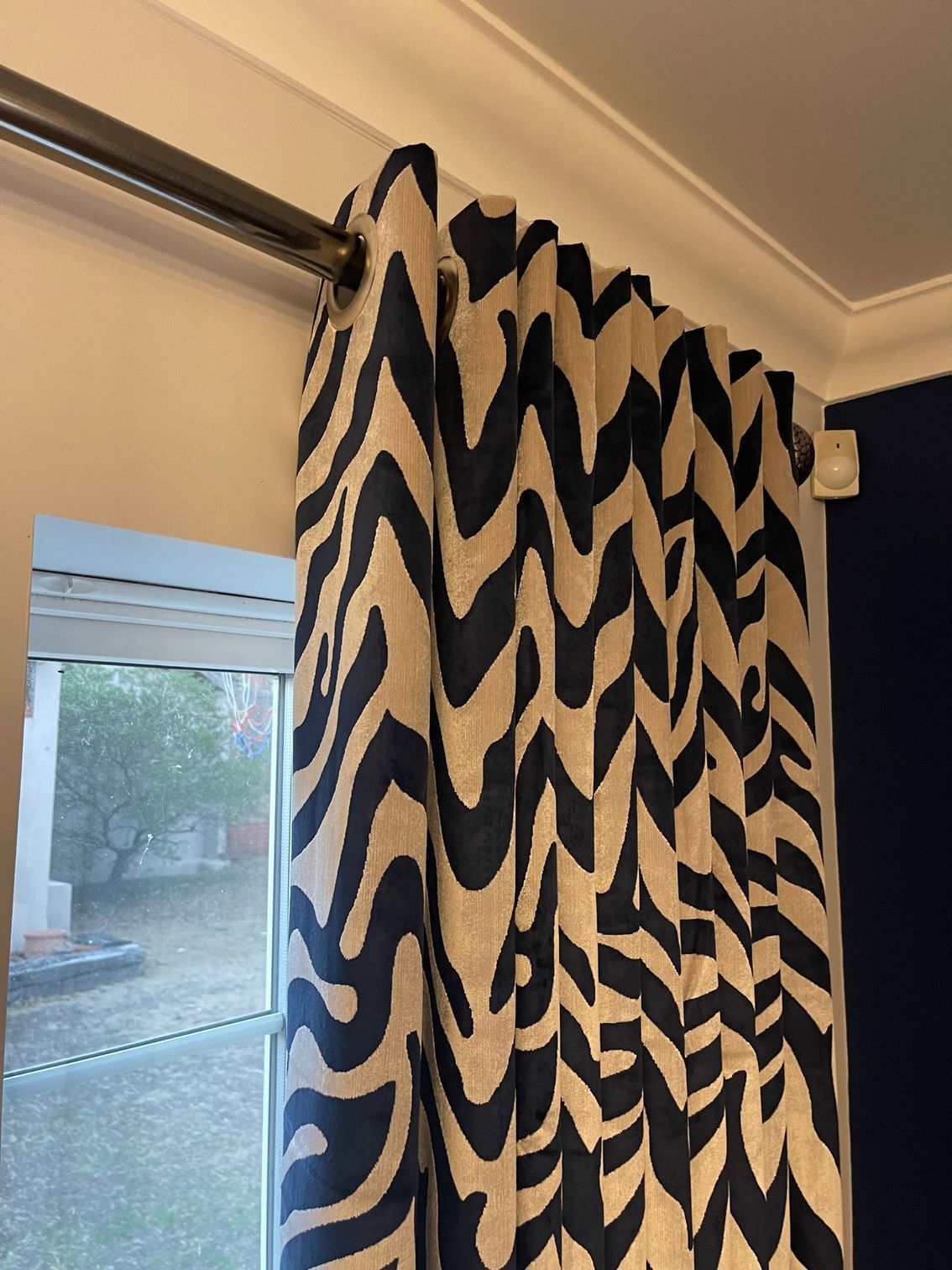 made to measure curtains in a modern fabric fitted onto a metal pole