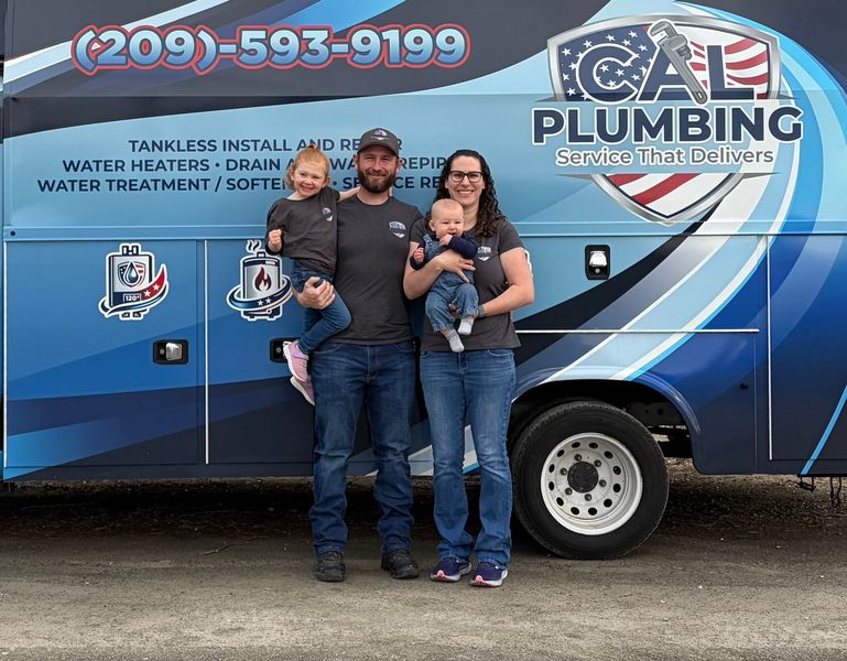 A family standing in front of a blue Cal Plumbing service truck, with the company's name, logo, and phone number visible.