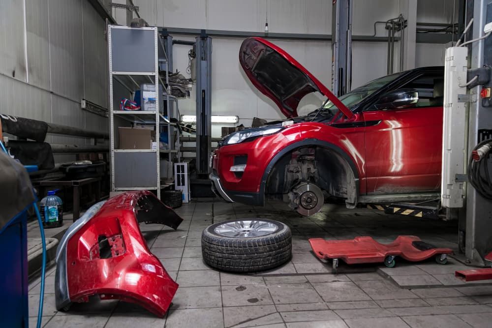 Car With an Open Hood Raised on a Lift — B.A Auto Repair Mechanic In Belconnen, ACT
