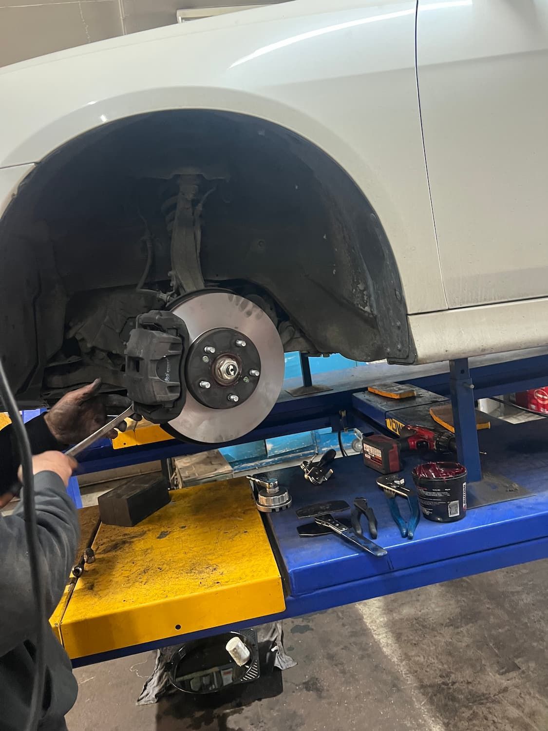 Hand of Mechanic Checking Breaking System - Mechanic in Belconnen, ACT
