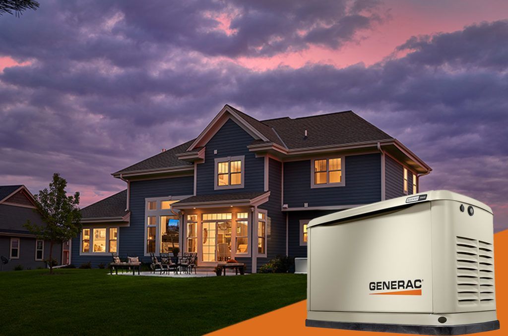 House at dusk with lit windows and a portable GENERAC generator in the foreground