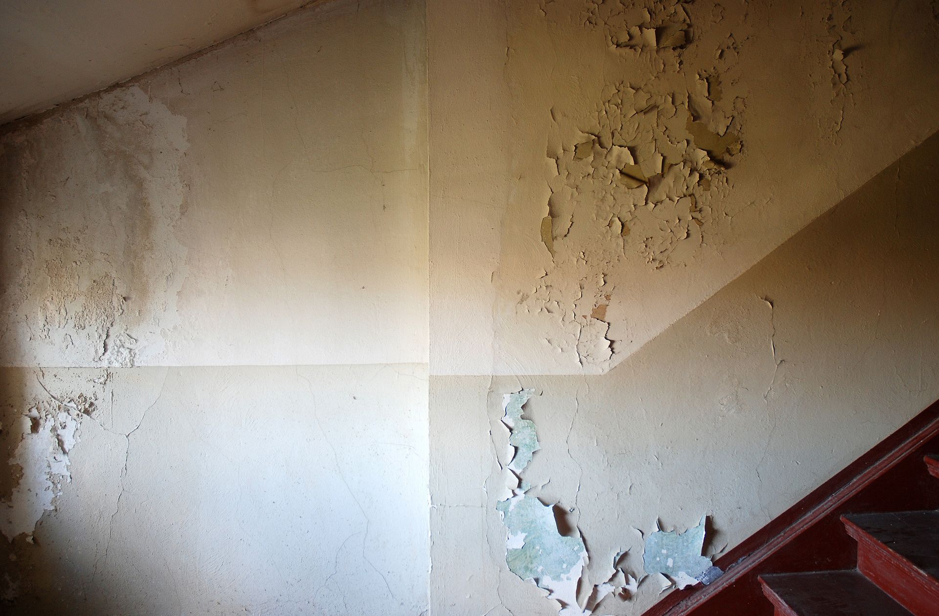 Indoor building walls with a water damage.