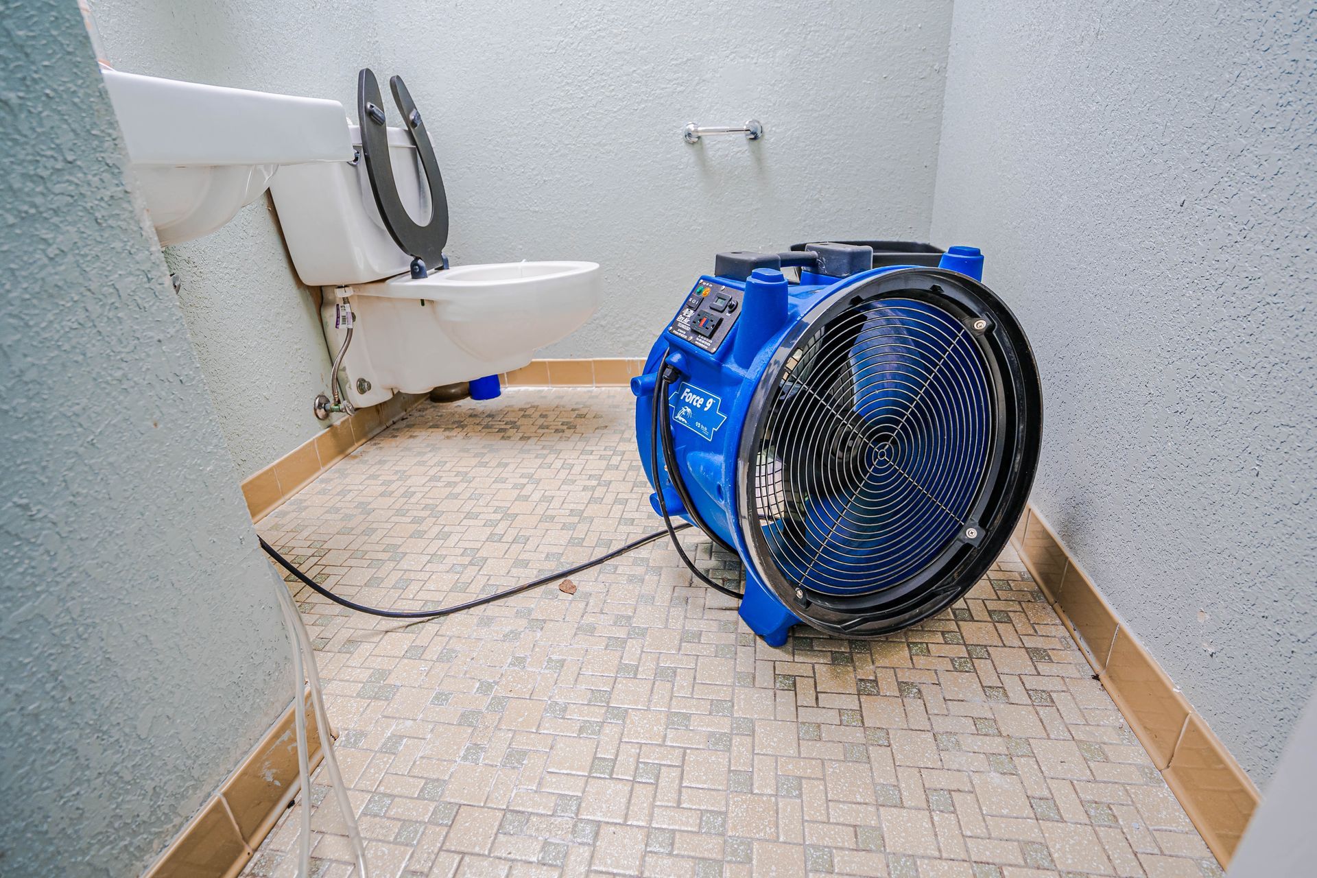 Water damage restoration services in a commercial restroom. Water damage restoration services in a commercial restroom.
