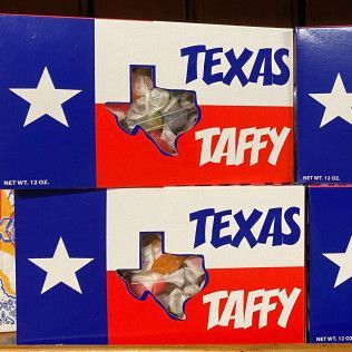 Boxes of Texas Taffy candy with red, white, and blue packaging and a Texas-shaped window