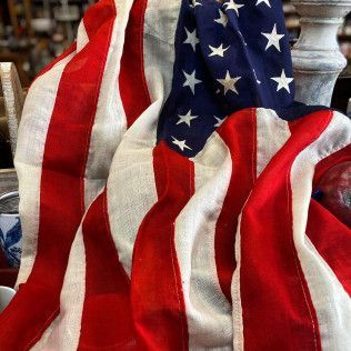 Folded American flag with red and white stripes and blue field of stars