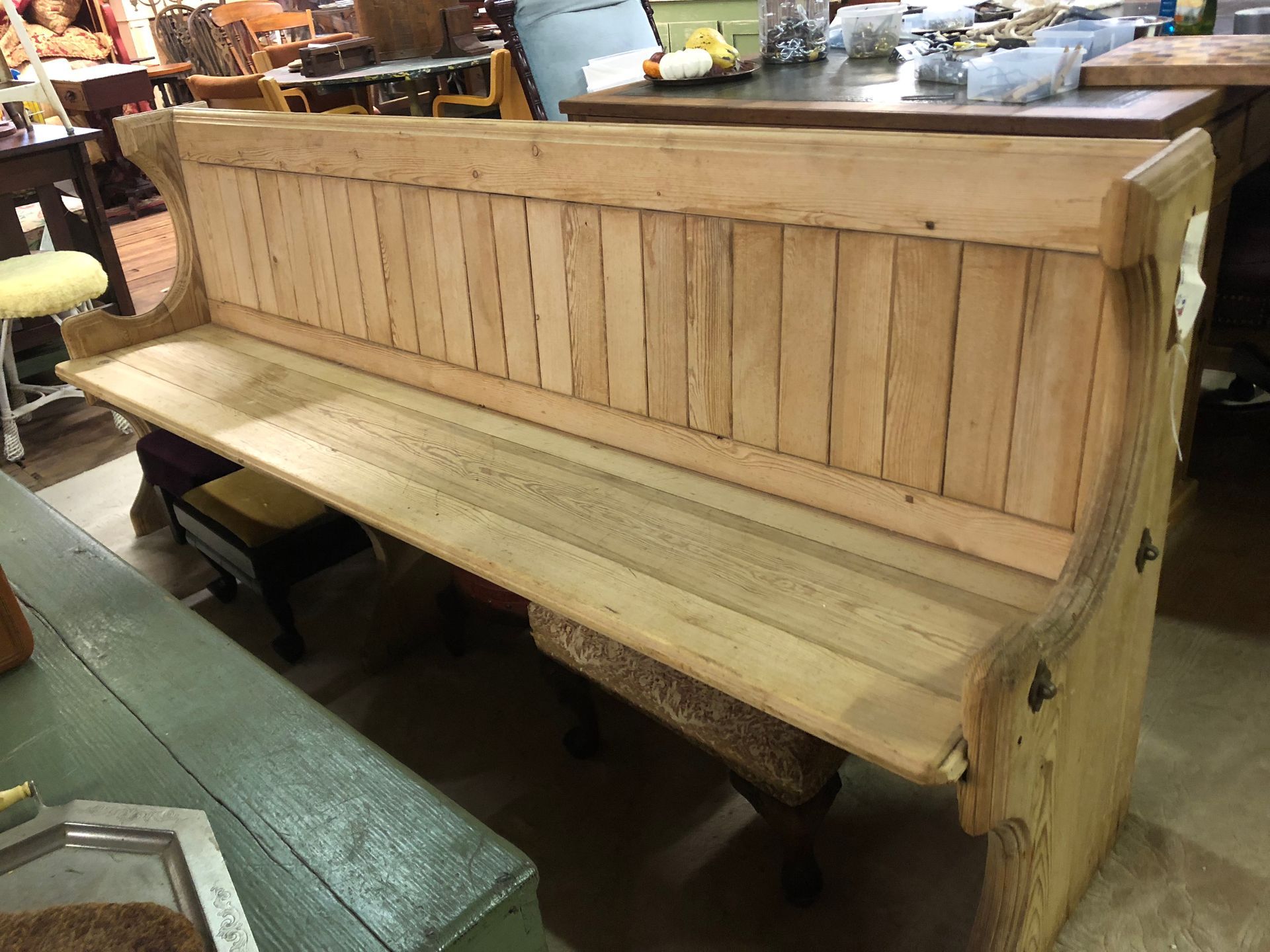 Wooden church pew bench with backrest in a shop or workshop