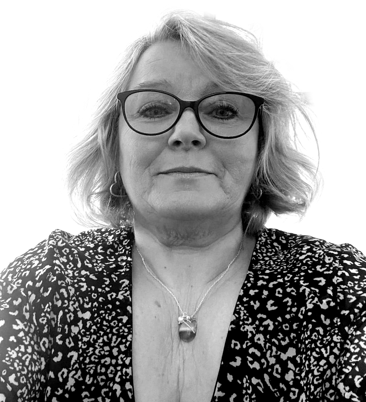 A black and white photo of a woman wearing glasses and a necklace.