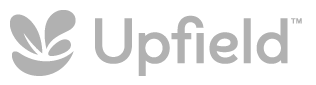 A logo for upfield with a leaf on it