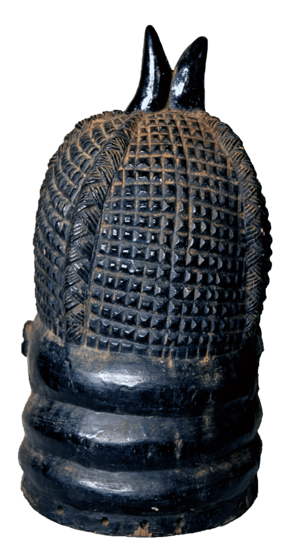 A black wooden sculpture featuring an ornate, grid-patterned cap and horizontal neck rings, topped with two small horns.