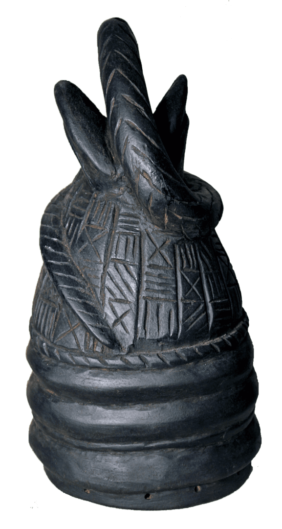 A black, bell-shaped carved wooden object with geometric patterned bands and an ornate, curved handle on top.