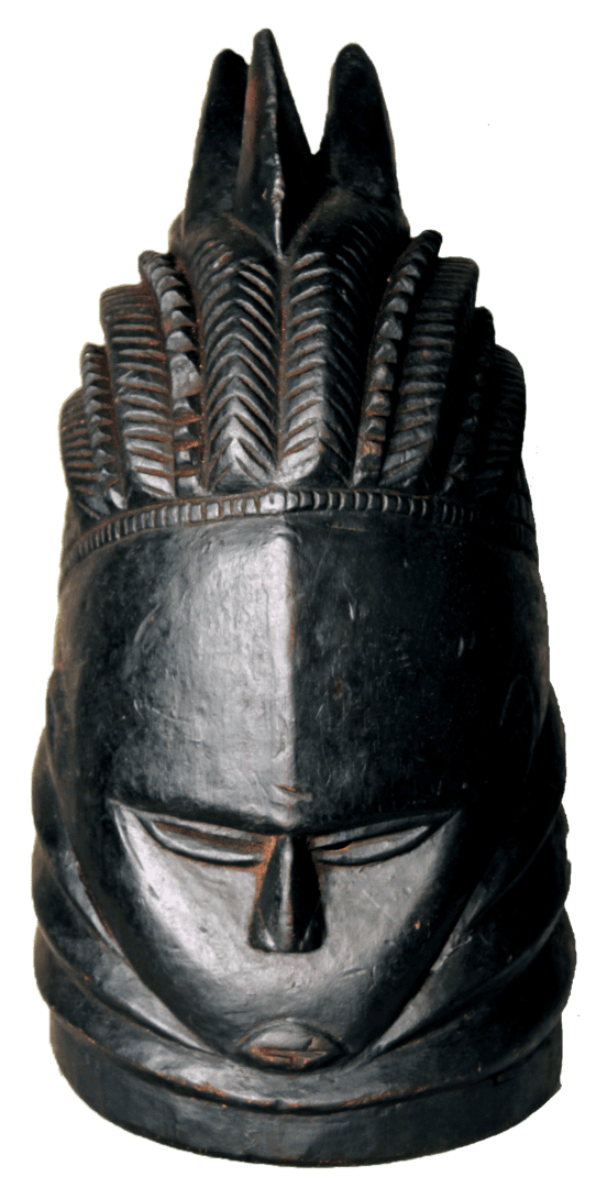 A dark, carved wooden helmet mask featuring an intricate, crested hairstyle and a serene, symmetrical facial expression.