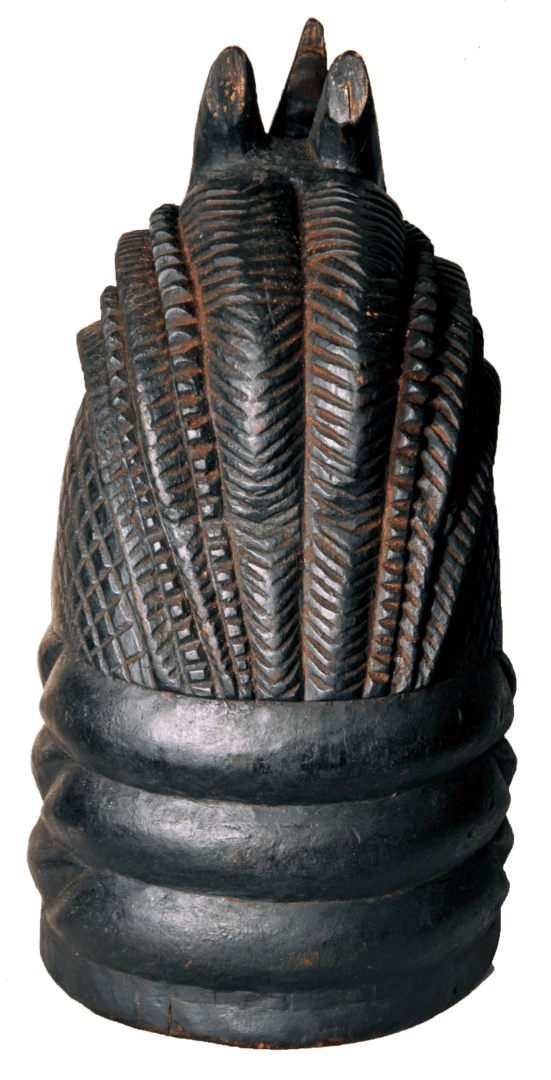 A carved, dark wooden object featuring vertical, textured grooves and horizontal rings at the base.