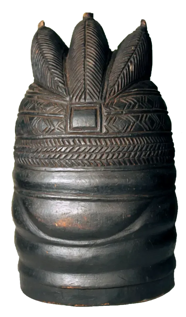 A dark, cylindrical wooden Mende helmet mask with carved, textured patterns and a tripartite crown-like top.