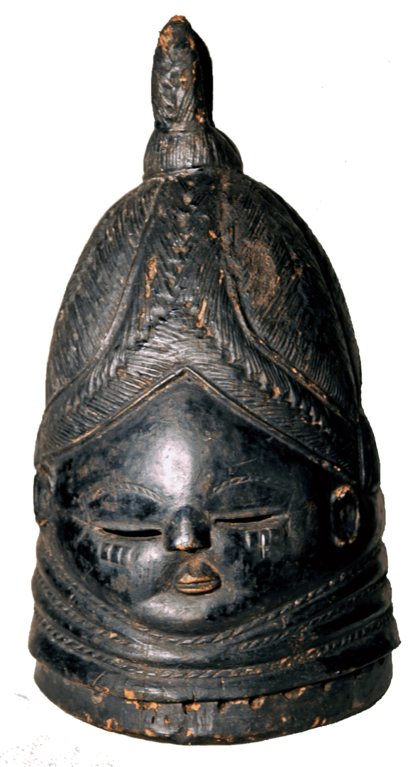 A dark, carved wooden Mende Sowei helmet mask with detailed facial features, elaborate hair styling, and neck rings.