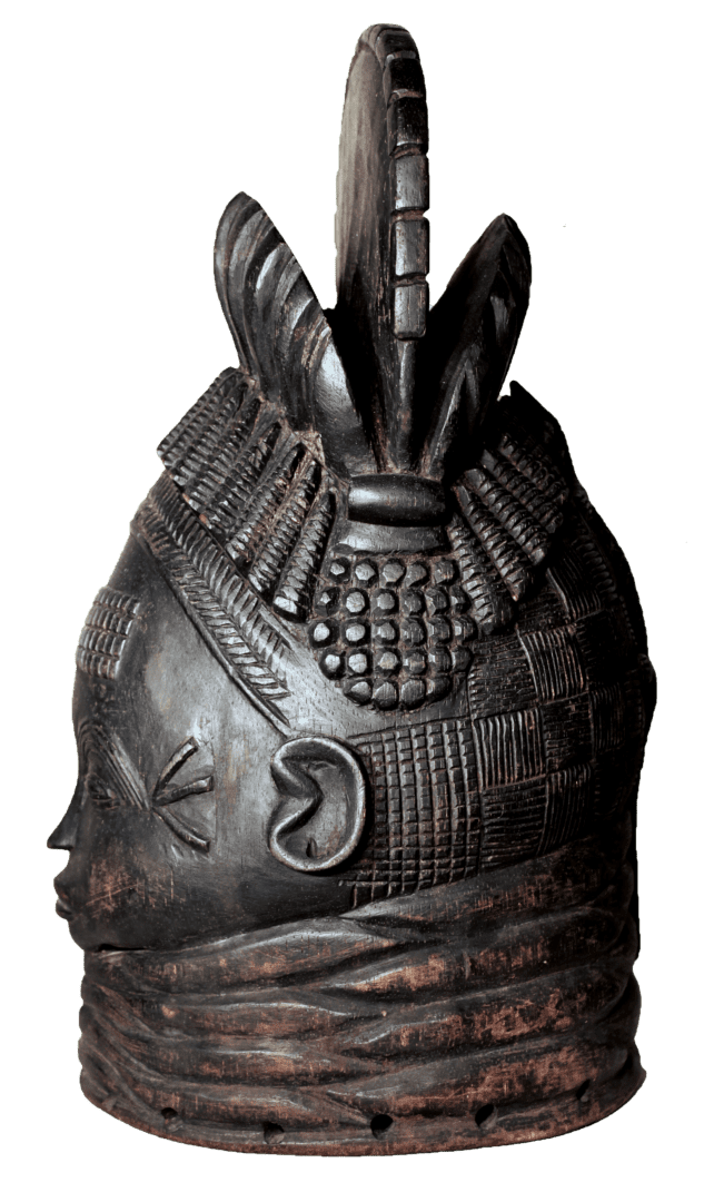 A dark, intricately carved Mende Sowei helmet mask with a layered neck, textured hair, and a central top crest.