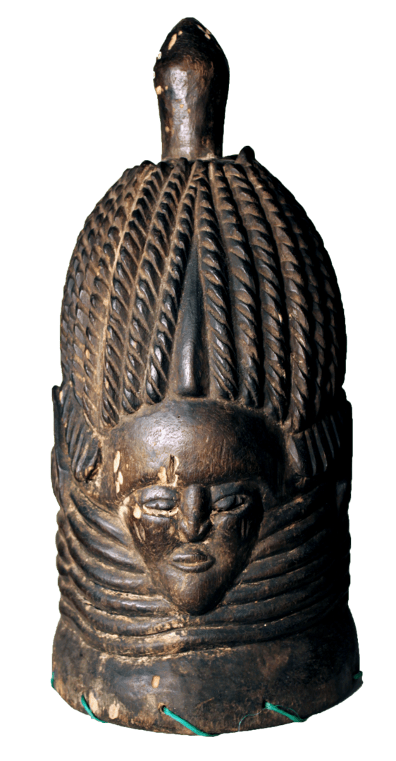 A dark, cylindrical wooden mask with a carved face, multiple neck rings, and a textured, braided-style headdress.