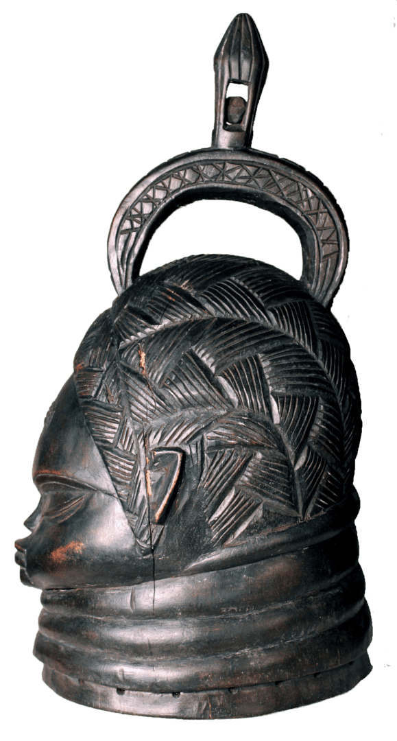Dark wooden carved helmet mask with intricate hair patterns, a ringed neck, and a decorative arched top handle.