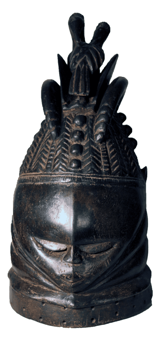 A dark wood Mende Sande society helmet mask with a serene, downcast expression and an elaborate, textured coiffure.