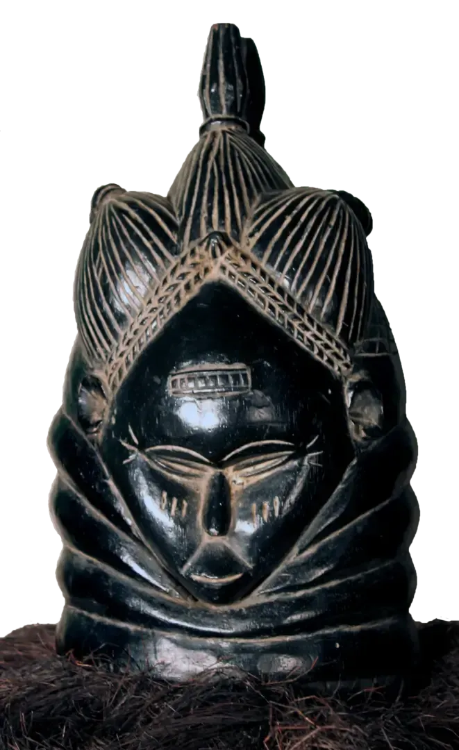 A black, polished Mende Sowei helmet mask with stylized features, elaborate hair carvings, and a raffia base.