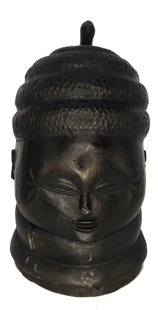 A dark, carved wooden head sculpture featuring a textured, tiered coiffure and prominent neck rolls.
