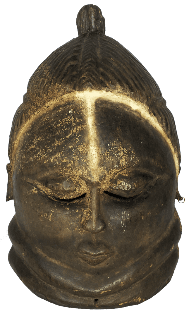 A dark, carved wooden mask with an intricate hairstyle, closed eyes, and ringed neck, set against a white background.