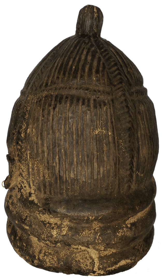 A dark, textured, rounded ceramic object with a top knob, featuring vertical ribs and a layered, weathered base.