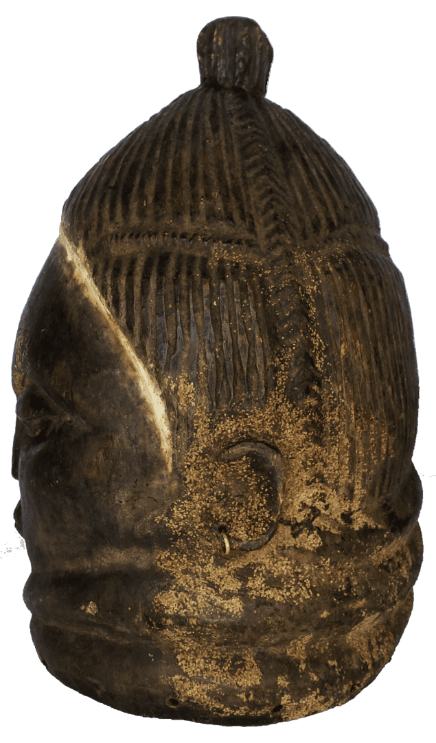A carved, dark wooden helmet mask featuring vertical etched lines, a central top knob, and layered, rounded facial forms.