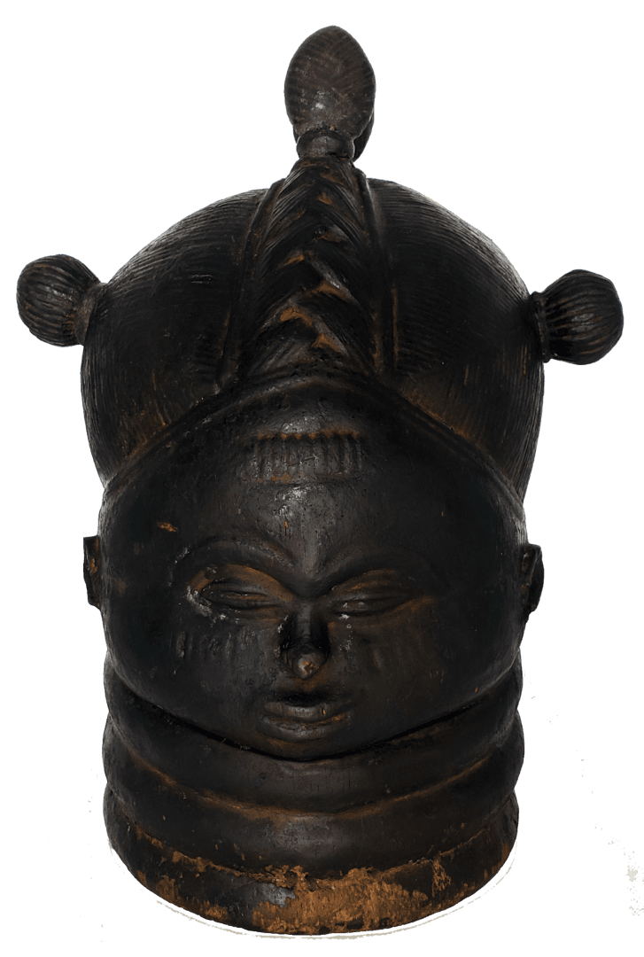 A dark, carved wooden Sowei mask with a textured headdress, rounded facial features, and rings around the neck.