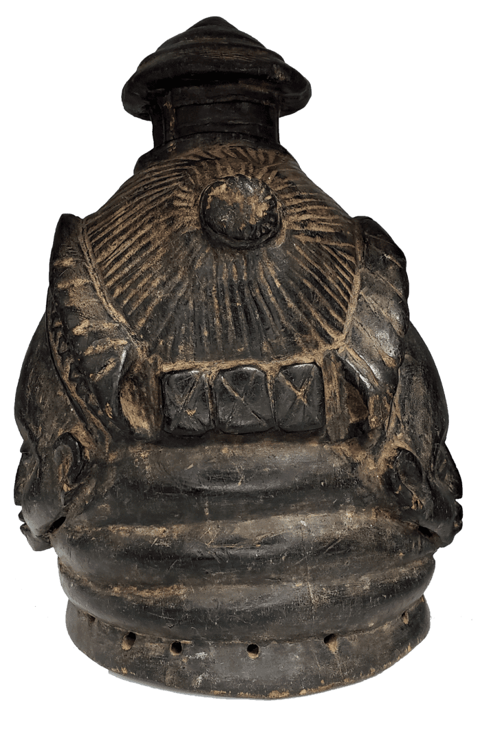 A dark, sculpted ceramic bell-shaped object with textured, radiating lines at the top and a row of small holes at the base.