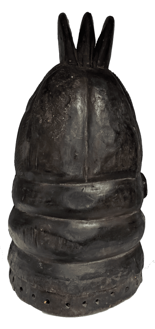 A dark, weathered helmet with a three-pronged crest and ridged base, centered against a white background.