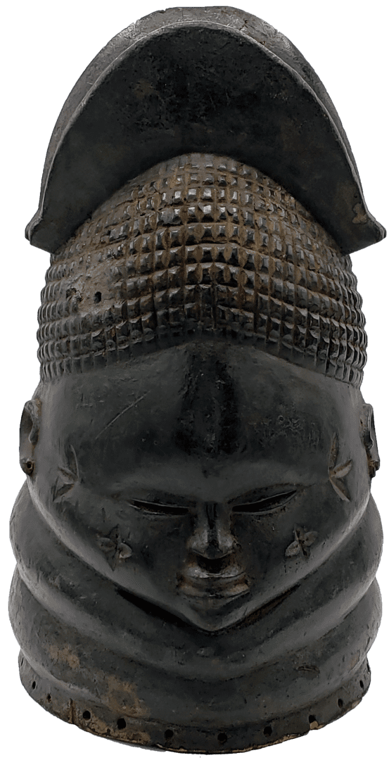 A dark wood-carved mask featuring a tiered hairstyle, incised facial markings, and horizontal ridges around the neck.