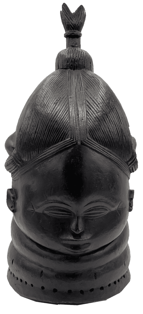 A carved black wooden mask featuring a detailed hairstyle, rings around the neck, and a small finial at the top.