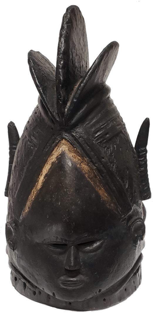 A carved wooden helmet mask with a dark, polished finish, featuring a central crest and geometric, stylized features.