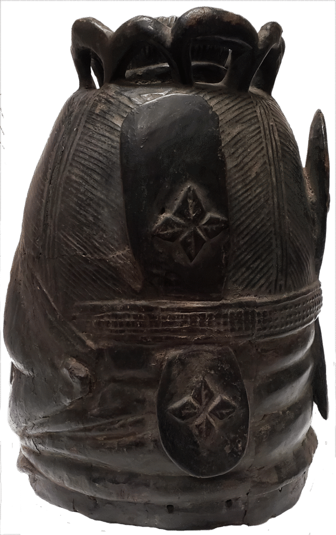A dark-toned, carved wooden vessel with a fluted, lobed top, textured geometric patterns, and floral relief carvings.