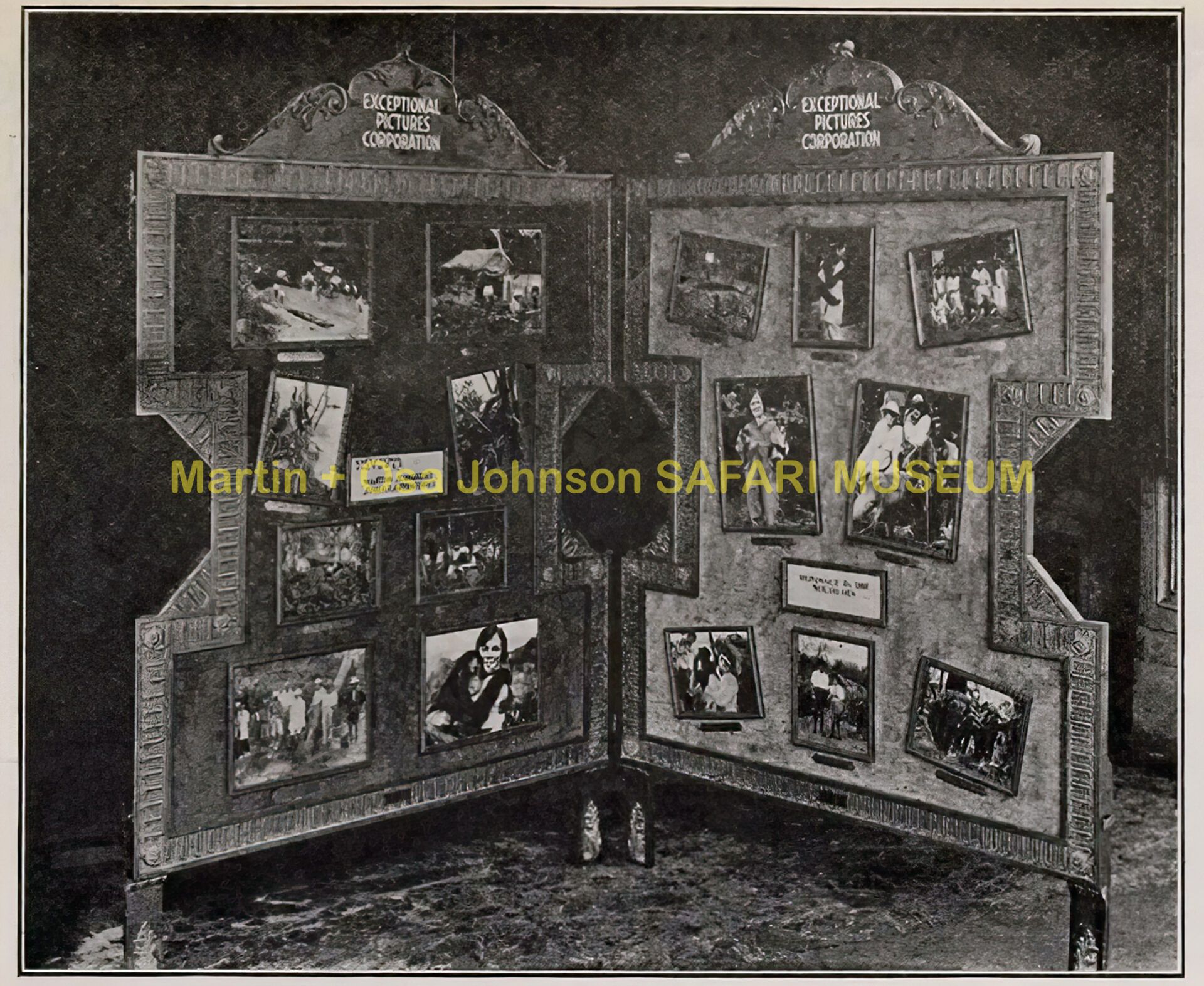 A foldable wooden display board featuring a collection of framed historical photographs from the Martin and Osa Johnson.