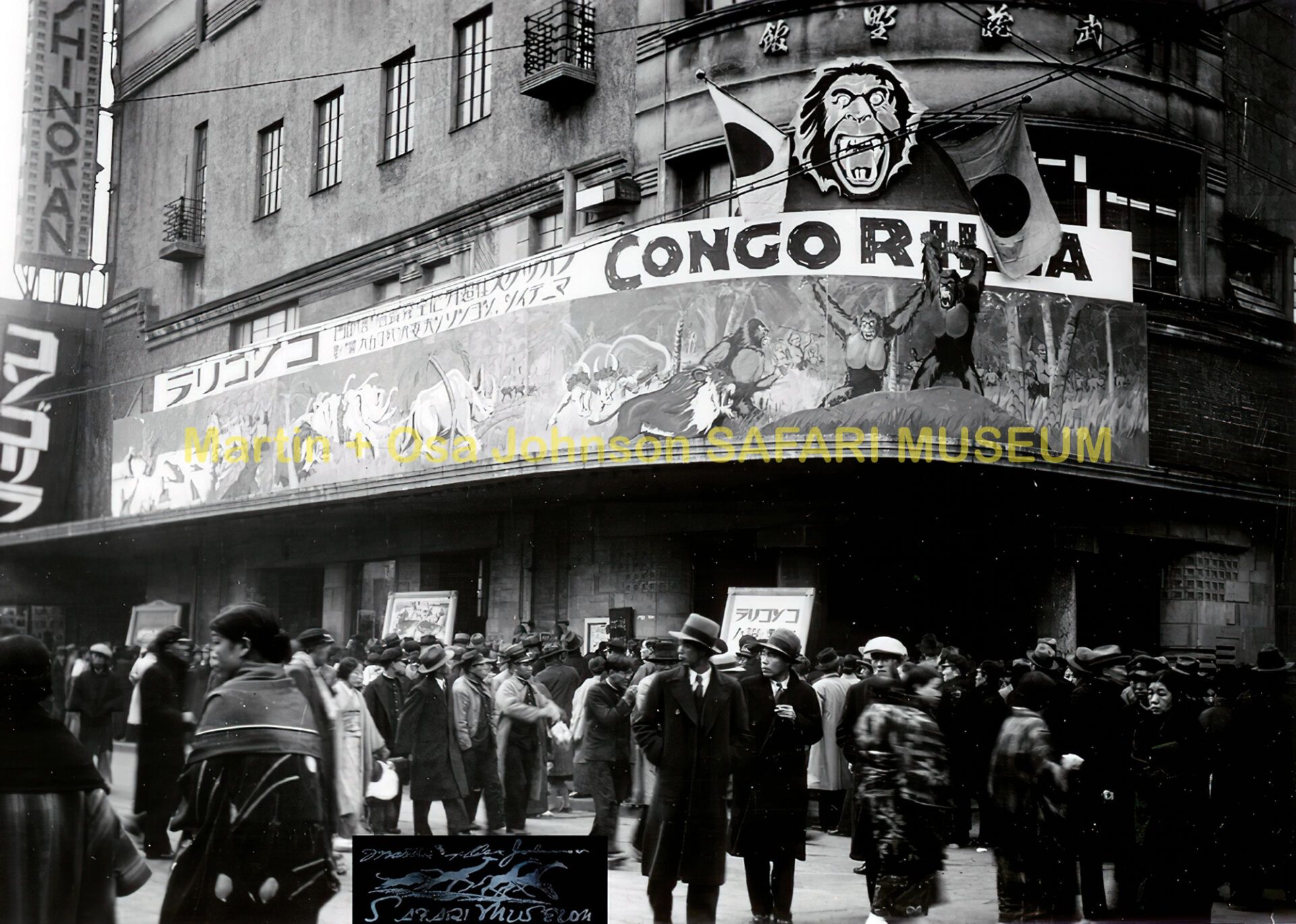 Crowd gathers outside a building with a