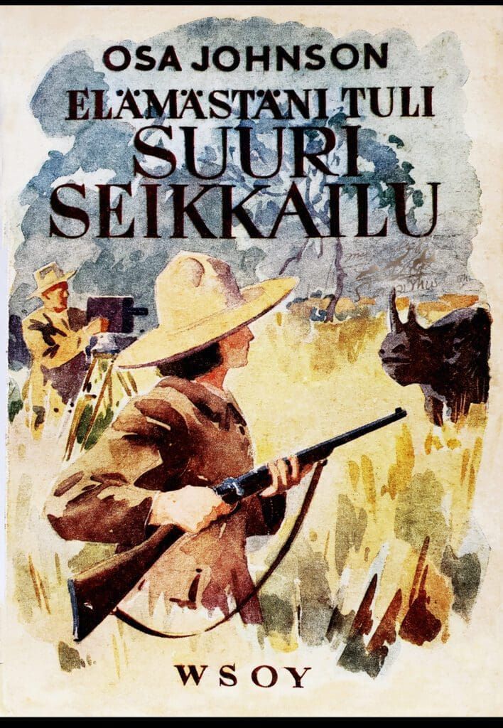 Book cover showing an explorer with a rifle facing a rhinoceros, with a camera operator in the background.