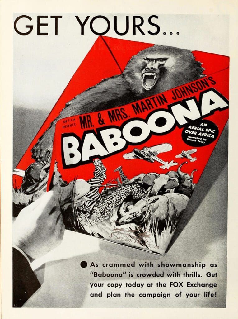 A hand holds a red-and-white promotional flyer for the film Baboona, featuring a baboon, planes, and wildlife.