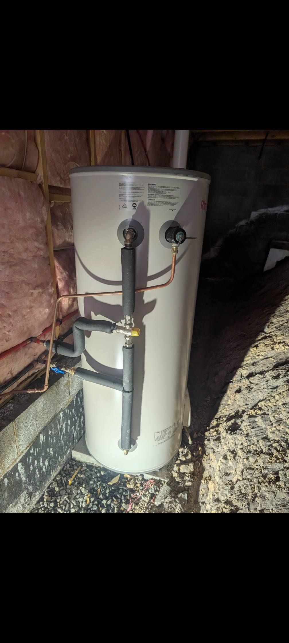 A Light Gray Cylindrical Water Heater Installed in an Attic — TasWide Plumbing in Kingston, TAS