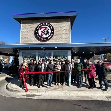 Group gathered outside a Seven Brew’s restaurant for a ribbon-cutting ceremony.